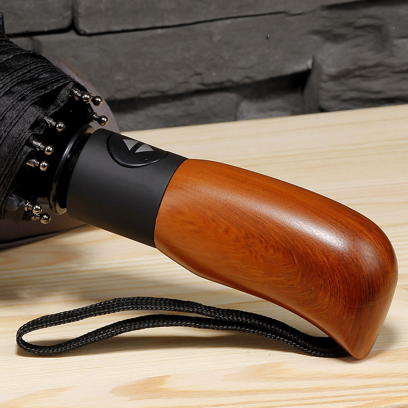 https://www.hodaumbrella.com/new-buy-bulk-wooden-handle-designer-auto-sunshade-paraguas-customised-compact-rain-automatic-windproof-3-folding-umbrella-product/